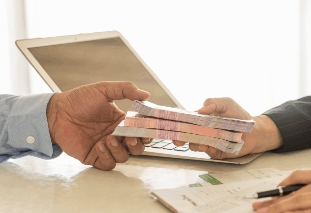 two people exchanging money