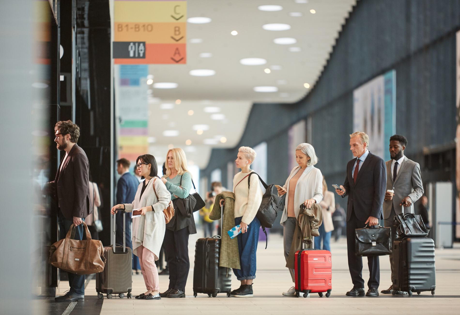 People waiting in a line at the airport