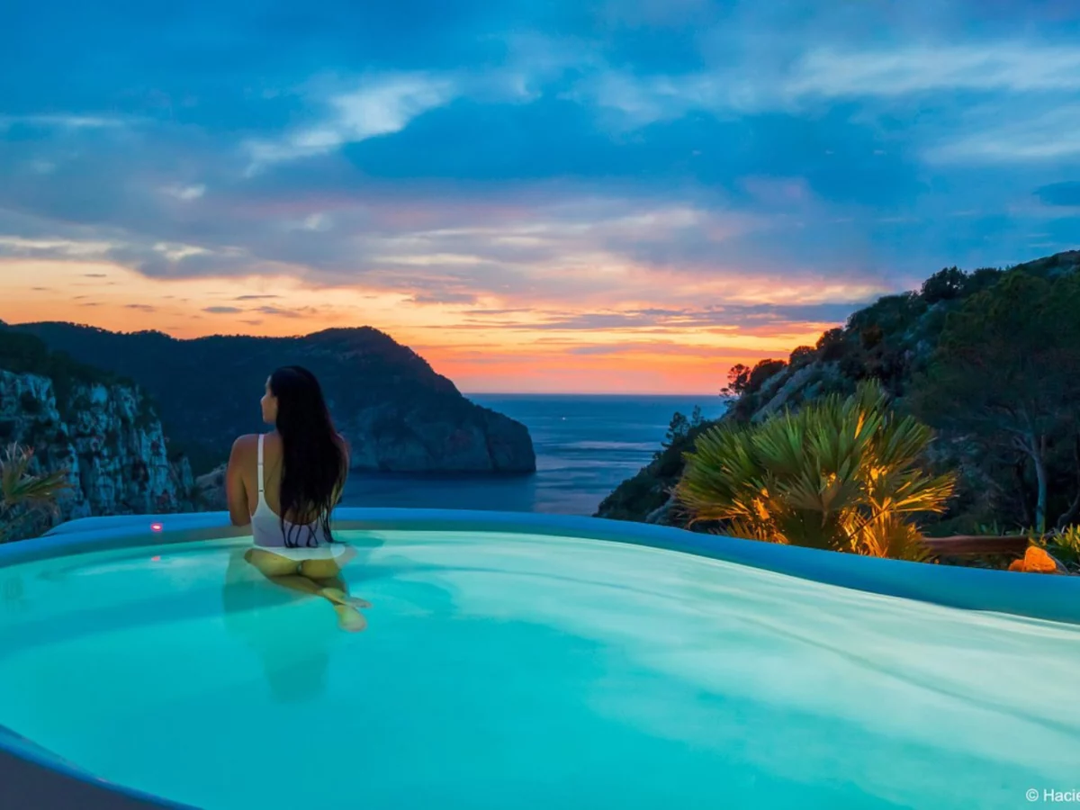 woman in rooftop pool, for story on best hotels in Ibiza